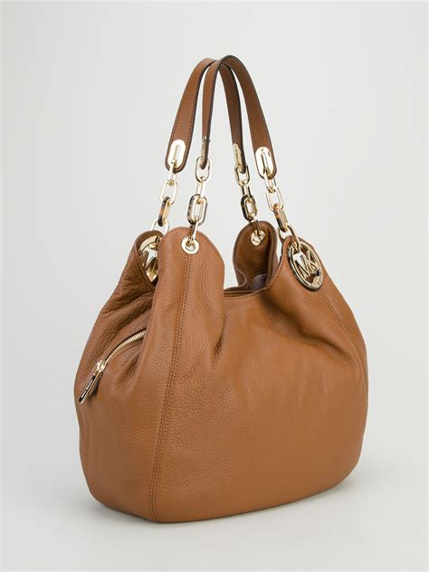 brown michael kors slouchy tassel purse|Michael Kors leather satchels.